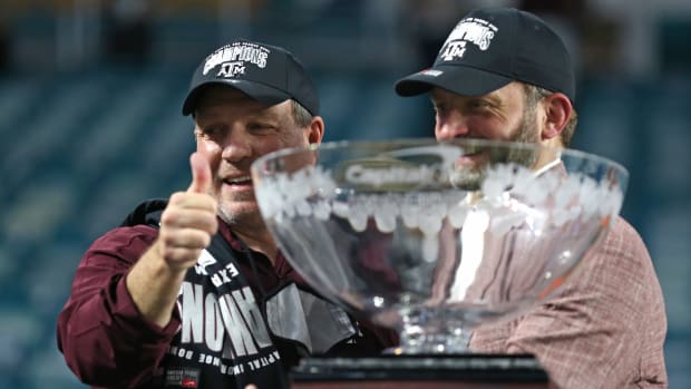 Jan 2, 2021; Miami Gardens, FL, USA; Texas A&M Aggies head coach Jimbo Fisher and Texas A&M Aggies Athletics Director Ross Bjork celebrate after winning the Orange Bowl against the North Carolina Tar Heels at Hard Rock Stadium. Mandatory Credit: Sam Navarro-USA TODAY Sports
